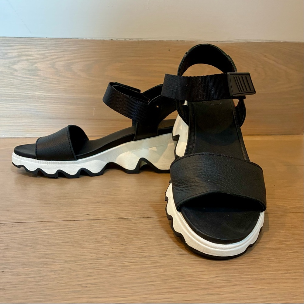 Sorel Black and White Kinetic Impact Leather Wedge Sandals